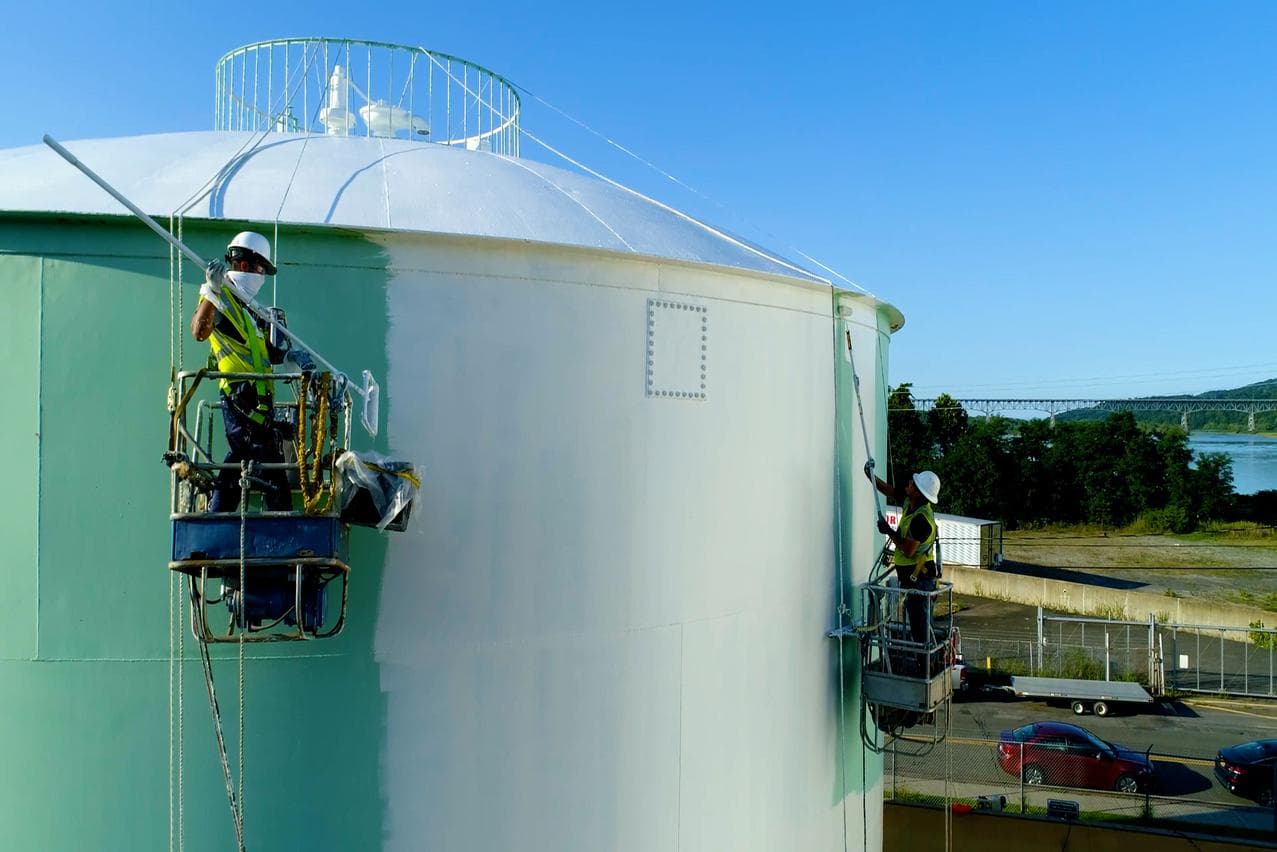 MPC workers painting an industrial storage tank