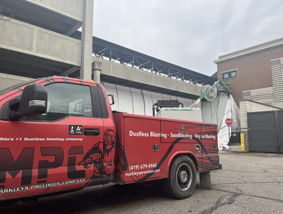 Bridge painting with containment system
