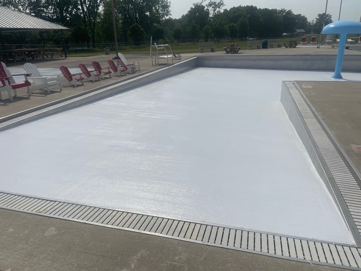 Completed commercial pool painting with lounge area