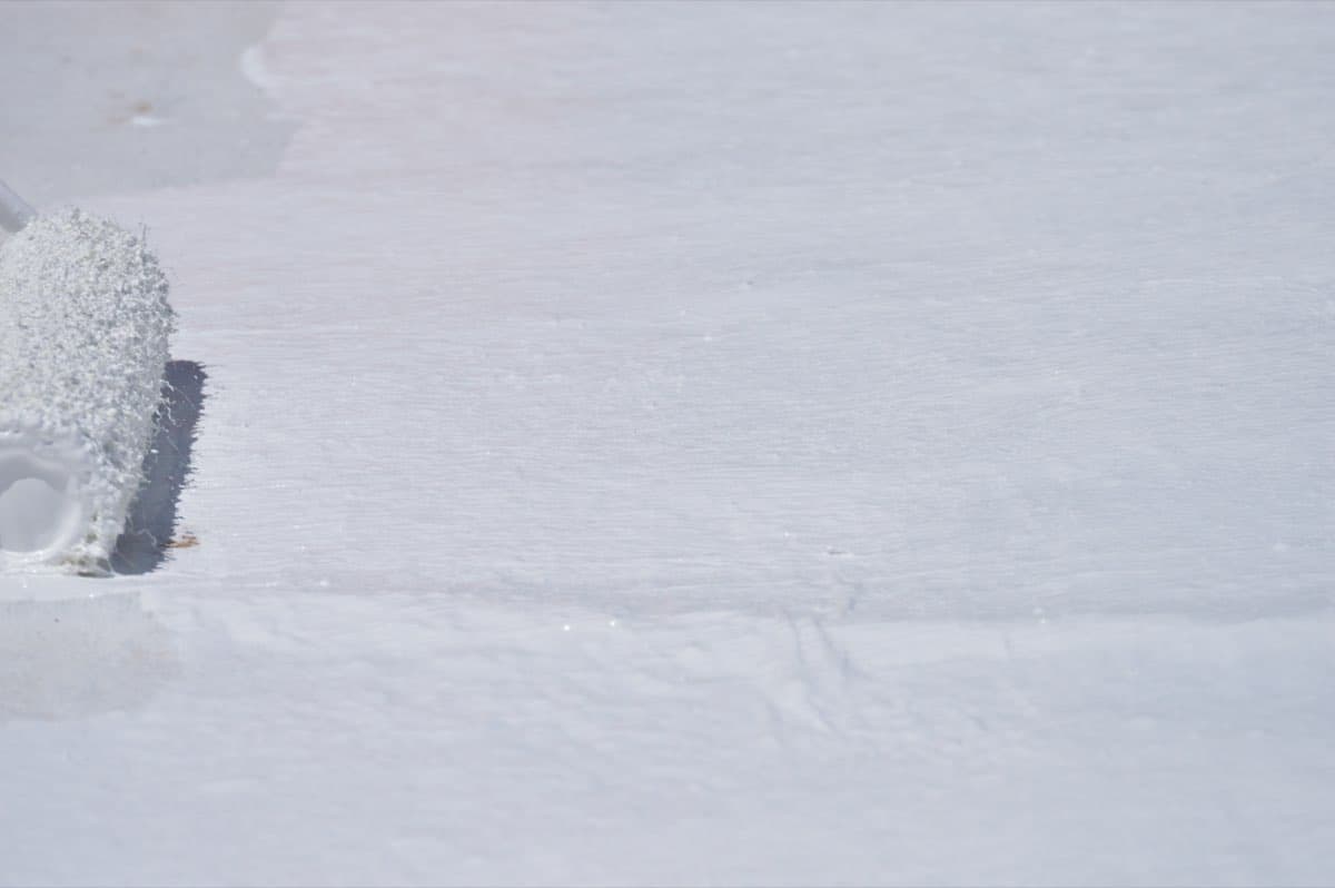 Close-up of roof coating application
