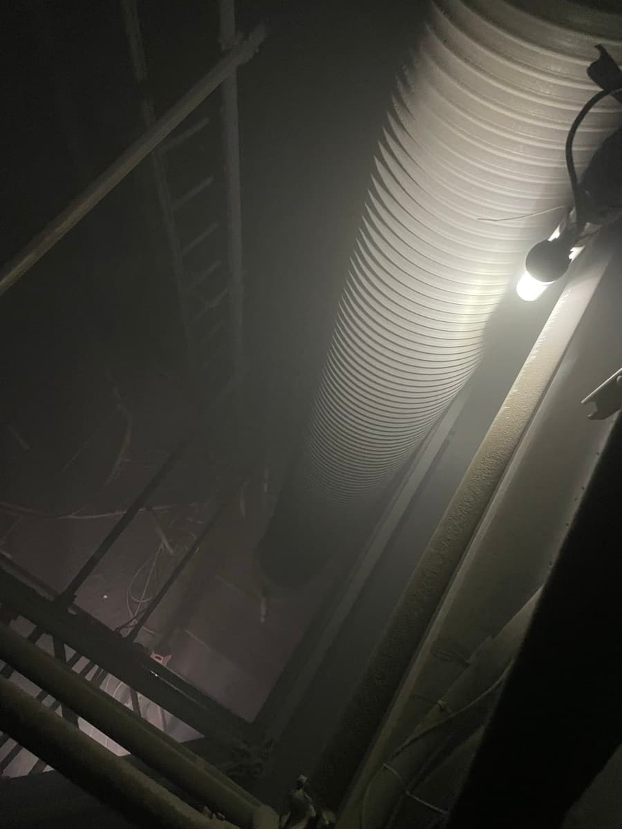 Interior tank sandblasting with containment and access equipment