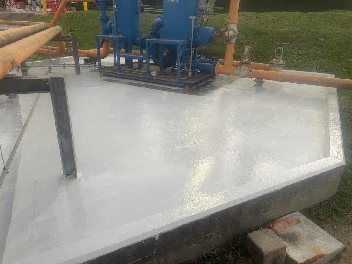 Concrete containment tank lining