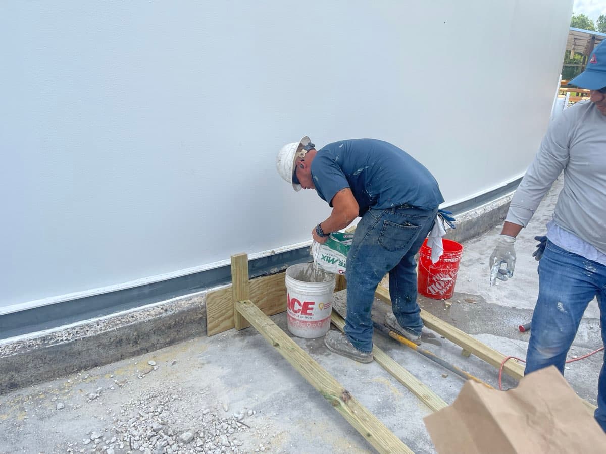 Containment tank lining application