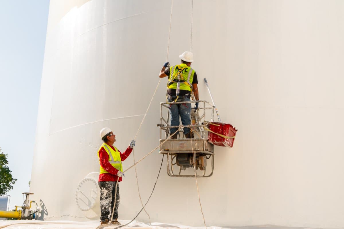 MPC crew painting a massive industrial storage tank