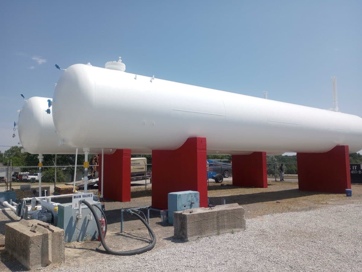 Large commercial propane tank freshly painted by Markley's Precision Company