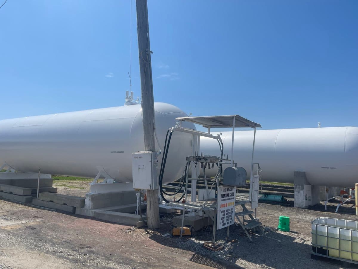 Large propane bullet tank at a distribution yard with fresh coating