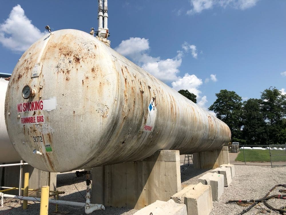 Rusty propane tank before sandblasting and painting by MPC