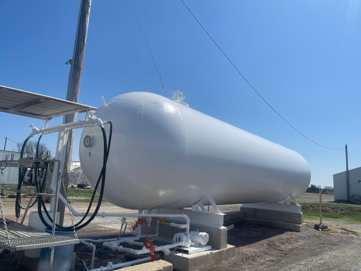 Single large propane tank with fresh white coating at a distribution facility