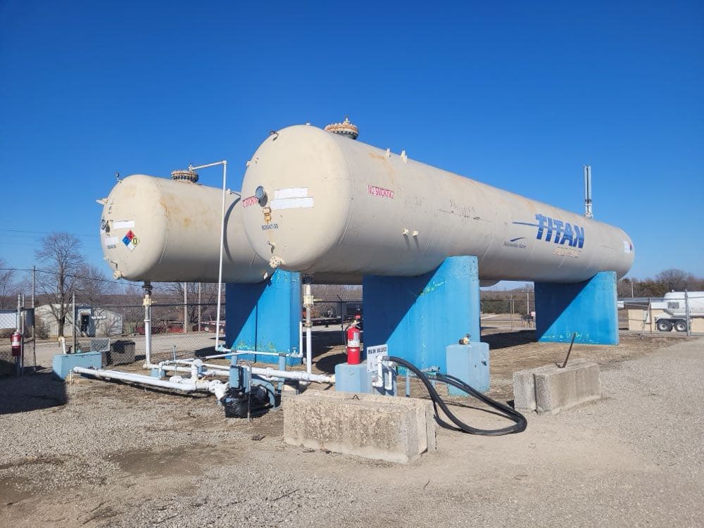 Propane distribution yard with large tanks before restoration by MPC